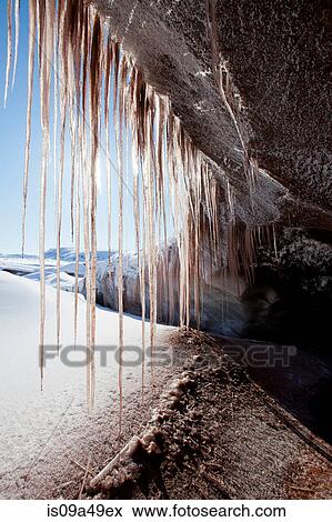 Stock Photo - Icicles hanging from rock formation. Fotosearch