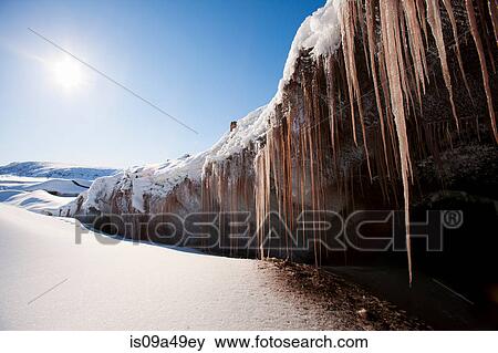 Icicles hanging from rock formation View Large Photo Image Stock Photo - Icicles hanging from rock formation. Fotosearch