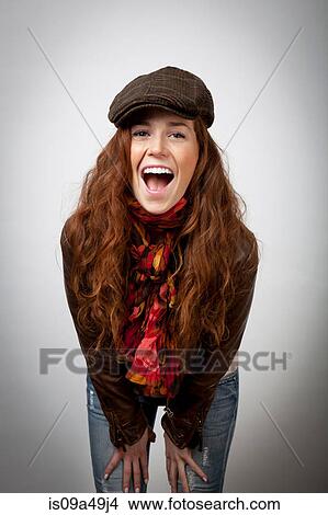 Laughing woman leaning on knees View Large Photo Image Picture - Laughing woman leaning on knees. Fotosearch