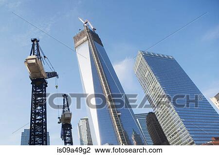 Low angle view of crane and skyscrapers View Large Photo Image Stock Image - Low angle view of crane and skyscrapers. Fotosearch