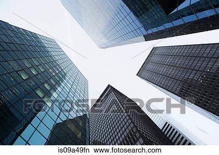 Low angle view of urban skyscrapers View Large Photo Image Picture - Low angle view of urban skyscrapers. Fotosearch