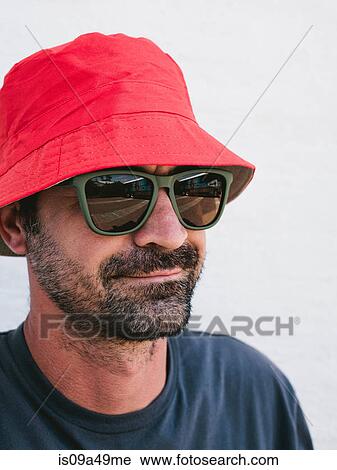 Man wearing hat and sunglasses View Large Photo Image Stock Image - Man wearing hat and sunglasses. Fotosearch