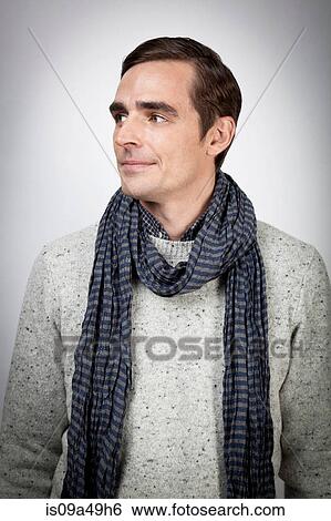 Man wearing scarf indoors View Large Photo Image Stock Photograph - Man wearing scarf indoors. Fotosearch