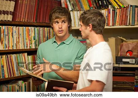 Men shopping together in thrift store View Large Photo Image Stock Image - Men shopping together in thrift store. Fotosearch