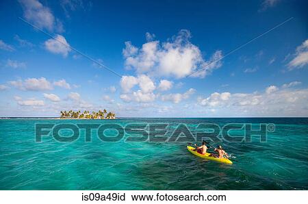 People rowing canoe in tropical water View Large Photo Image Stock Image - People rowing canoe in tropical water. Fotosearch