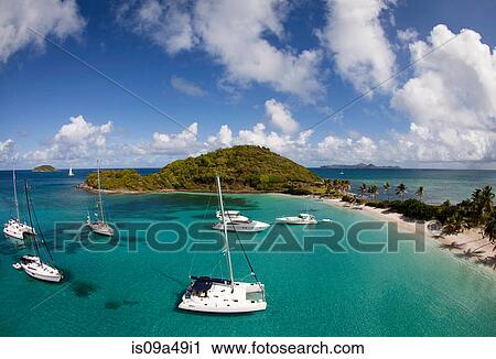 Stock Image - Sailboats in tropical water. Fotosearch