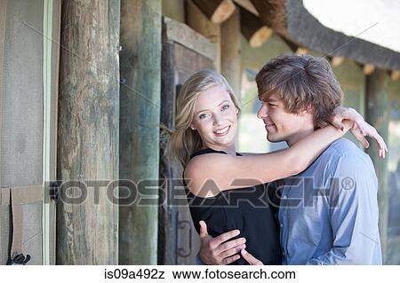 Smiling couple hugging outdoors View Large Photo Image Stock Photo - Smiling couple hugging outdoors. Fotosearch