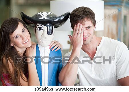 Stock Photograph - Smiling couple shopping in store. Fotosearch