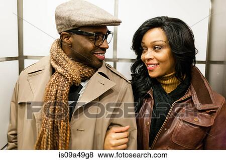 Stock Photo - Smiling couple walking together. Fotosearch