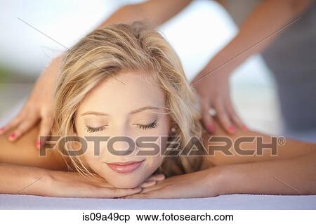 Smiling woman having massage View Large Photo Image Stock Photography - Smiling woman having massage. Fotosearch