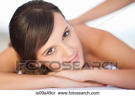 Stock Photography - Smiling woman having massage. Fotosearch