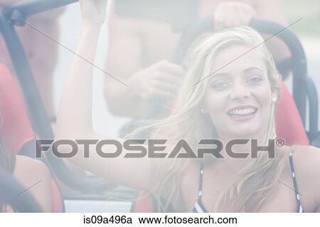 Smiling woman riding in jeep View Large Photo Image Stock Image - Smiling woman riding in jeep. Fotosearch