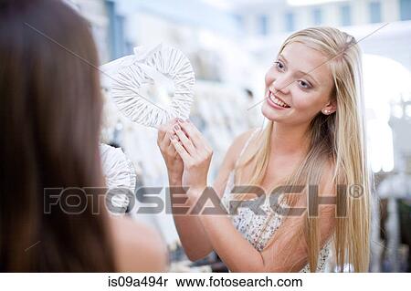 Smiling woman shopping in store View Large Photo Image Stock Photography - Smiling woman shopping in store. Fotosearch
