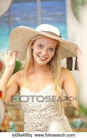 Stock Photography - Smiling woman shopping in store. Fotosearch