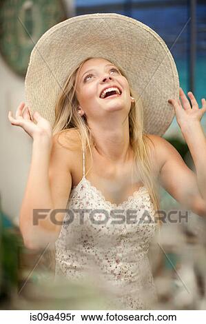 Smiling woman shopping in store View Large Photo Image Stock Photography - Smiling woman shopping in store. Fotosearch
