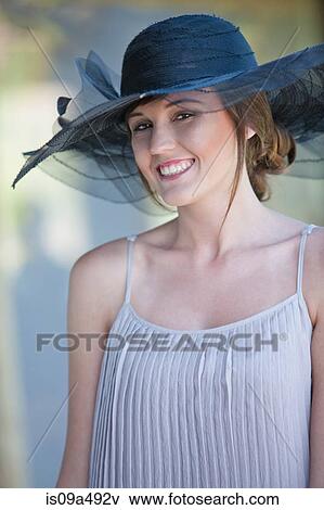 Stock Photo - Smiling woman standing outdoors. Fotosearch