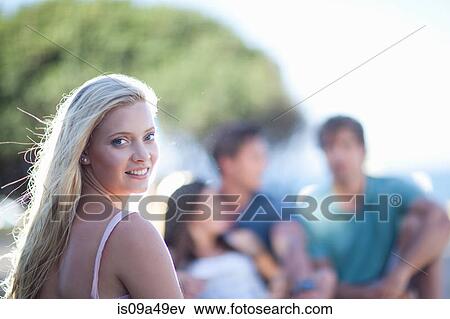 Stock Photo - Smiling woman walking outdoors. Fotosearch