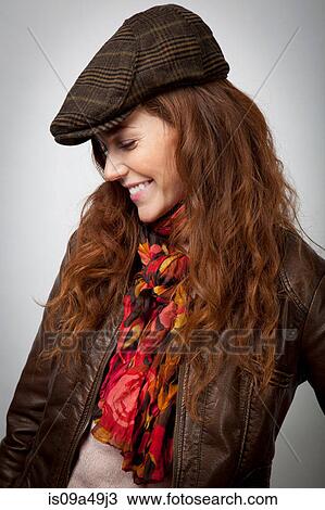 Smiling woman wearing hat and jacket View Large Photo Image Stock Image - Smiling woman wearing hat and jacket. Fotosearch