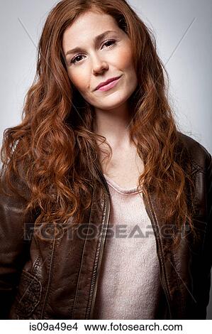 Picture - Smiling woman wearing jacket. Fotosearch