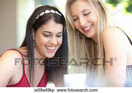 Smiling women sitting together View Large Photo Image Stock Photography - Smiling women sitting together. Fotosearch
