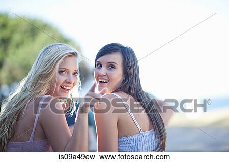 Stock Photo - Smiling women talking outdoors. Fotosearch