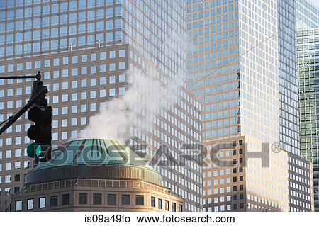 Smoke coming from urban building View Large Photo Image Picture - Smoke coming from urban building. Fotosearch