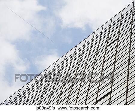 Urban skyscraper under blue sky View Large Photo Image Stock Photograph - Urban skyscraper under blue sky. Fotosearch