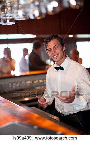 Waiter taking order at restaurant bar View Large Photo Image Stock Image - Waiter taking order at restaurant bar. Fotosearch