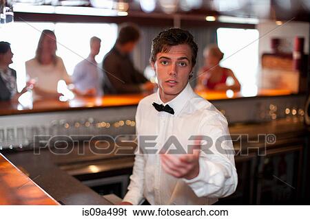 Waiter taking order at restaurant bar View Large Photo Image Stock Photograph - Waiter taking order at restaurant bar. Fotosearch