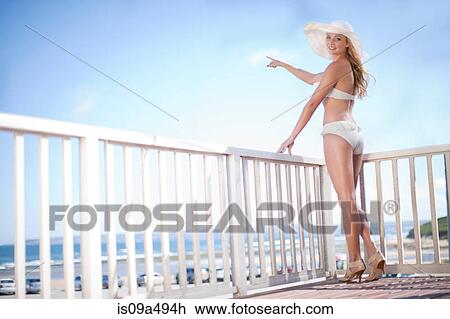 Stock Image - Woman admiring scenery outdoors. Fotosearch