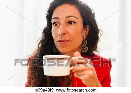 Stock Photo - Woman drinking cup of coffee. Fotosearch