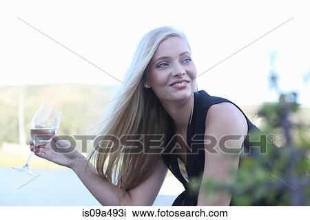 Woman drinking wine outdoors View Large Photo Image Stock Image - Woman drinking wine outdoors. Fotosearch