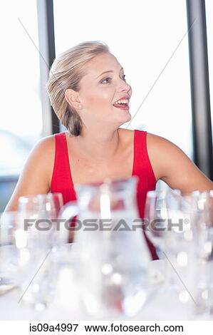 Woman having dinner at restaurant View Large Photo Image Stock Photo - Woman having dinner at restaurant. Fotosearch