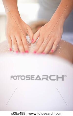 Woman having salt scrub on beach View Large Photo Image Stock Image - Woman having salt scrub on beach. Fotosearch