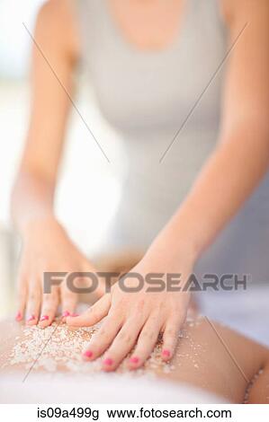 Woman having salt scrub on beach View Large Photo Image Stock Image - Woman having salt scrub on beach. Fotosearch