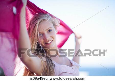 Woman playing with scarf outdoors View Large Photo Image Stock Photograph - Woman playing with scarf outdoors. Fotosearch