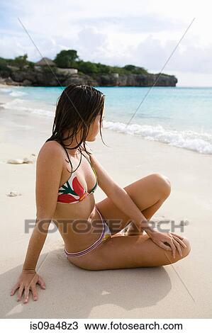 Woman relaxing on tropical beach View Large Photo Image Stock Image - Woman relaxing on tropical beach. Fotosearch