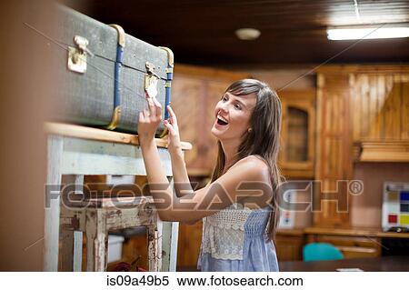 Woman shopping in thrift store View Large Photo Image Stock Photography - Woman shopping in thrift store. Fotosearch