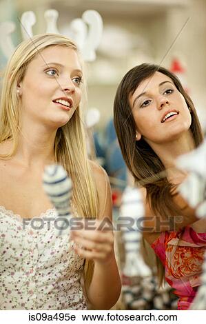 Woman shopping together in store View Large Photo Image Stock Image - Woman shopping together in store. Fotosearch
