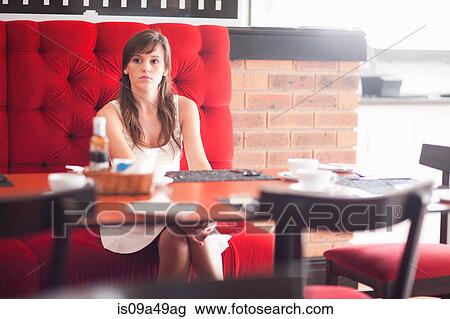 Woman sitting in cafe View Large Photo Image Stock Image - Woman sitting in cafe. Fotosearch