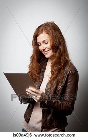 Stock Photograph - Woman using tablet computer. Fotosearch
