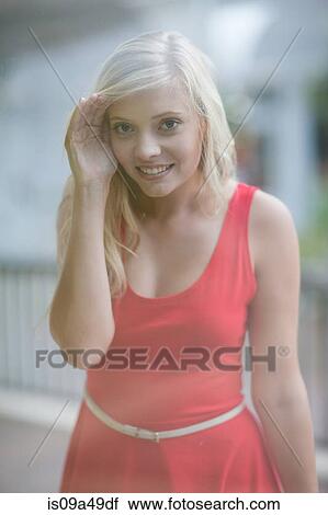 Stock Image - Woman window shopping on street. Fotosearch