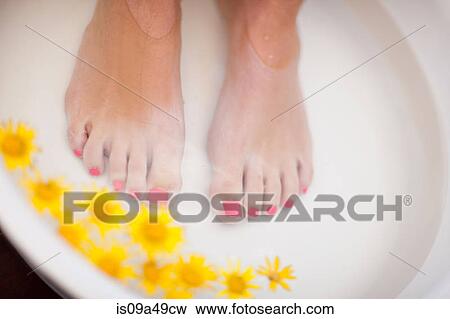 Stock Photo - Woman's feet soaking in tub. Fotosearch