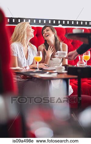 Women having breakfast together in cafe View Large Photo Image Stock Image - Women having breakfast together in cafe. Fotosearch