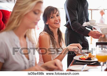 Women having breakfast together in cafe View Large Photo Image Stock Image - Women having breakfast together in cafe. Fotosearch