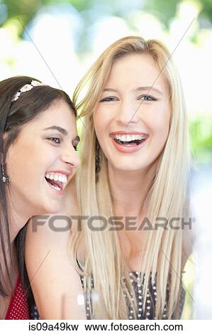 Women laughing together View Large Photo Image Stock Photo - Women laughing together. Fotosearch