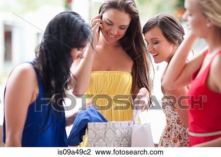 Women looking in shopping bag View Large Photo Image Stock Image - Women looking in shopping bag. Fotosearch