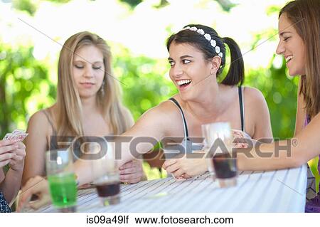 Women playing cards at table View Large Photo Image Stock Image - Women playing cards at table. Fotosearch