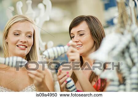 Women shopping together in store View Large Photo Image Stock Image - Women shopping together in store. Fotosearch