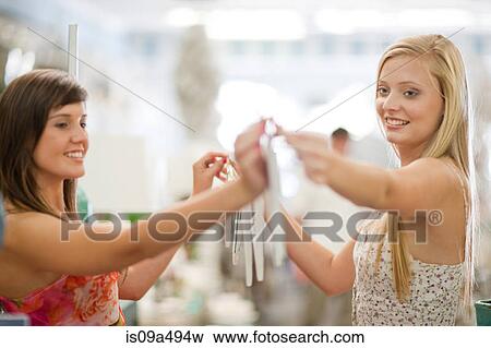 Women shopping together in store View Large Photo Image Stock Photo - Women shopping together in store. Fotosearch